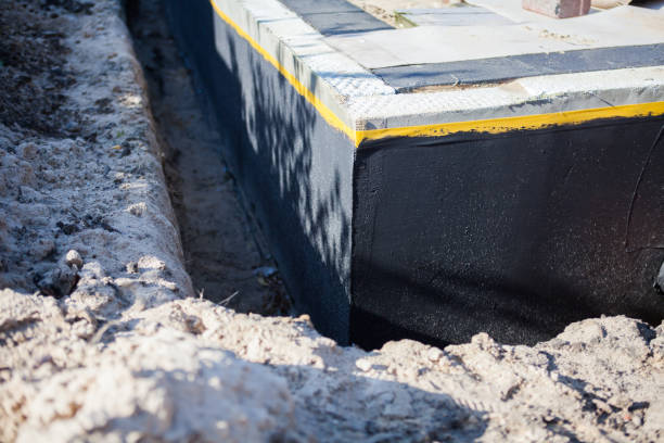Professional Waterproofing technician working in Oak Harbor, OH